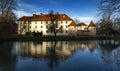 Otocec Castle on the Krka River in Slovenia, beautiful scene with reflection on water