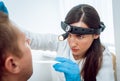 Otolaryngologist examines man`s throat with spatula. Medical equipment