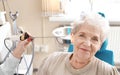 Otolaryngologist examining senior woman\'s ear with ENT telescope in hospital Royalty Free Stock Photo