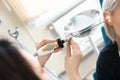 Otolaryngologist examining woman's ear with ENT telescope in hospital Royalty Free Stock Photo