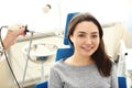 Otolaryngologist examining woman's ear with ENT telescope in hospital Royalty Free Stock Photo