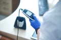 Otolaryngologist preparing the equipment for an audiometry test