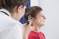 Otolaryngologist using otoscope Royalty Free Stock Photo