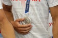 Details with a Tokyo 2020 Olympic Games silver medal won by a Romanian male athlete
