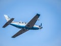 Light aircraft Piper PA-46-600TP (M600), belonging to OK Aviation Group, flying against blue sky