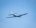 Light aircraft Piper PA-46-600TP (M600), belonging to OK Aviation Group, flying against blue sky