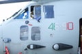 A military pilot of an Alenia C-27J Spartan military cargo plane from the Italian Air Force is cleaning the windscreen of the