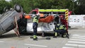 Romanian first responders train to extricate and save the victim of a car accident during a drill exercise.