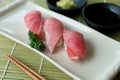 Otoro tuna sushi on black plate along with Japanese sauce and gr Royalty Free Stock Photo