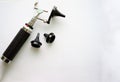 Otoscope for ear check for doctor ENT with three sizes of specula pieces on blur background with copy space