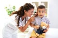 Otoscope ear examination performed by a young doctor Royalty Free Stock Photo