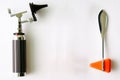 Otoscope and hammer jerk on floor ,top view with copy space Royalty Free Stock Photo