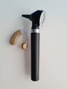 Otoscope and hearing aid for ear on white background Royalty Free Stock Photo