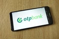 OTP Bank logo displayed on smartphone