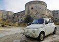 Classic Fiat Cinquecento in front of Medieval Aragonese Castle in Otranto, Apulia, Italy Royalty Free Stock Photo