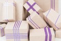 Ots of gift boxes with purple ribbons, close-up