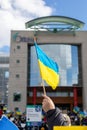 Rally with in support of Ukraine against war. Protest and march against Russian invasion. Ukranian flag against City