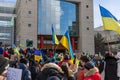 Rally with in support of Ukraine against war. Protest and march against Russian invasion. People with Ukranian flags in