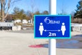 Ottawa, Canada - March 20, 2021: physical distance of 2 m sign in park Royalty Free Stock Photo