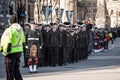 Soldiers from Canadian Army, men and women from the Royal Canadian navy wearing remembrance poppy, standing on ceremony