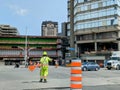 Ottawa, Canada, 21.05.2023: Road site worker controlling traffic flow on the junction Royalty Free Stock Photo