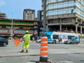 Ottawa, Canada, 21.05.2023: Road site worker controlling traffic flow on the junction Royalty Free Stock Photo