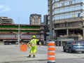 Ottawa, Canada, 21.05.2023: Road site worker controlling traffic flow on the junction Royalty Free Stock Photo