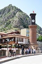 Ottoman houses and old clock tower on the bridge from Amasya city center in Turkey