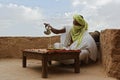 man pouring Moroccan traditional soft drink called Mint tea