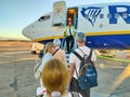 Ouarzazate, Morocco - October 01, 2023: Airplane passengers prepare to board at the front of the plane