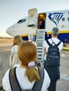 Ouarzazate, Morocco - October 01, 2023: Airplane passengers prepare to board at the front of the plane.