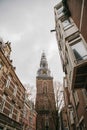 Oudekerk Bell Tower with clock In Amsterdam, Netherlands