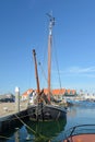 Old sailing boat anchored at dock at Oudeschild harbor on island Texel