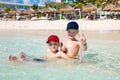 Oudoor summer activity. Concept of fun, health and vacation. Happy bothers boys eight and five years old relax and