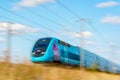 A Ouigo TGV Duplex high-speed train in the french countryside with motion blur Royalty Free Stock Photo