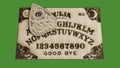 Ouija table isolated on green background Royalty Free Stock Photo