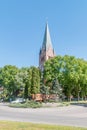 Oundabout named after Marshal Jozef Pilsudski and tower of Church of the Nativity of the Blessed Virgin Mary in background Royalty Free Stock Photo