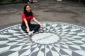 Oung Asian woman sitting on the Imagine mosaic