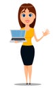 Oung attractive businesswoman in smart casual clothes standing with laptop