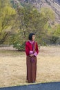 Oung Bhutanese girl in traditional women dress named kira, wonju long-sleeved blouse and a short jacket toego