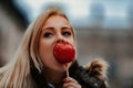 Apple in hand, woman admires cultural wonders