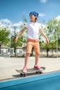 oung skateboarder balancing on the board during the skateboarding workout Royalty Free Stock Photo