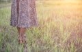 Oung woman carrying shoes when she tired to walk in forest