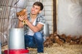 ÃÂ¡ountryman holding chicken in hands