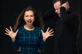 ouple having conflict, bad relationships. Angry fury woman screaming man closing his ears.