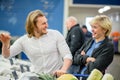 Ouple having fun while choosing fish in the supermarket. Royalty Free Stock Photo