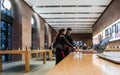 Ouple inside Apple Store deciding to buy latest MacBook Pro