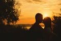 ÃÂ¡ouple kissing on the sunset at the Garda Lake, Italy.