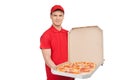 Our best pizza for you. Young cheerful pizza man holding an open Royalty Free Stock Photo