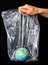 Our blue planet trapped in plastic waste stock photo